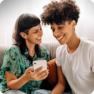 A photo of couple smiling together.