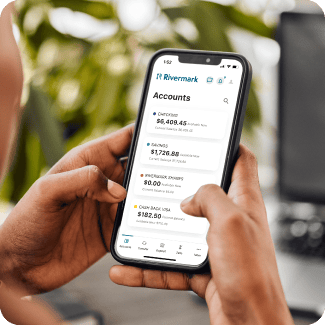 A zoomed-in photo of a phone screen with the Accounts section of the Rivermark mobile app on the screen.