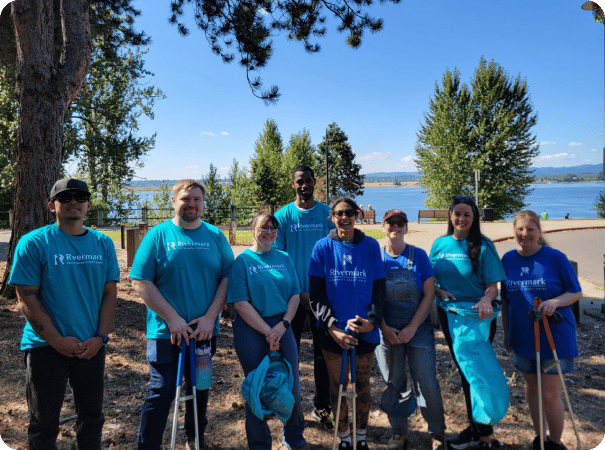 Rivermark volunteers cleaning up trash.