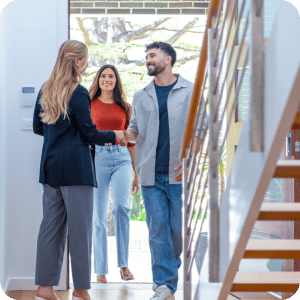 Couple meeting a realtor to see a new home.