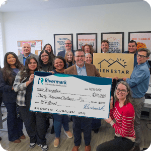 Bienstar Group of people accepting check.