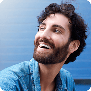 Man with beard looking to his side