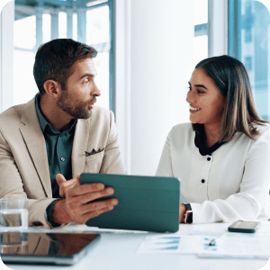 An advisor is going over with a client the options on his iPad.