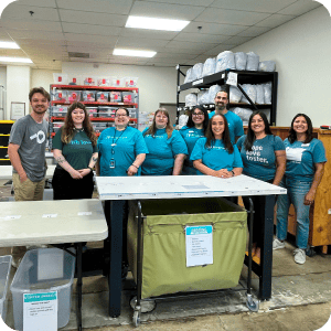Group of volunteers smiling at the camera.