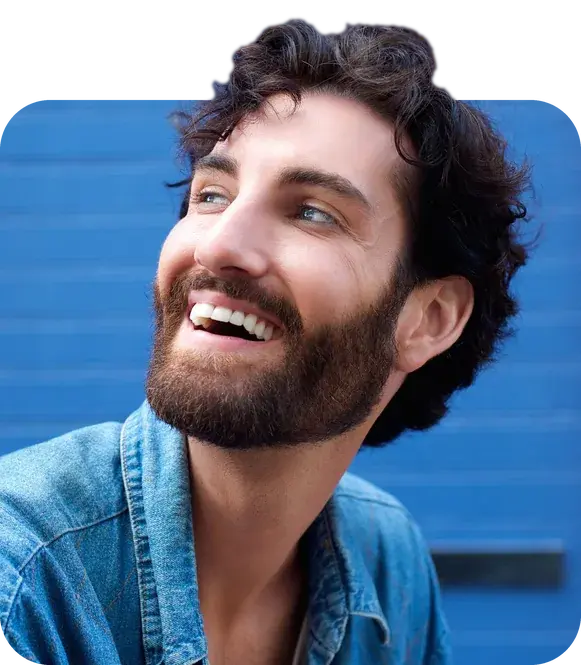 A man with a beard looking off to the side.