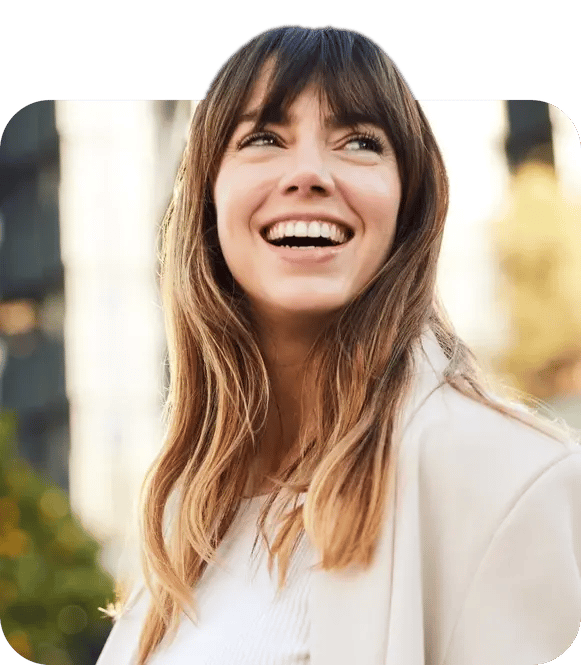 A woman smiling and looking up.