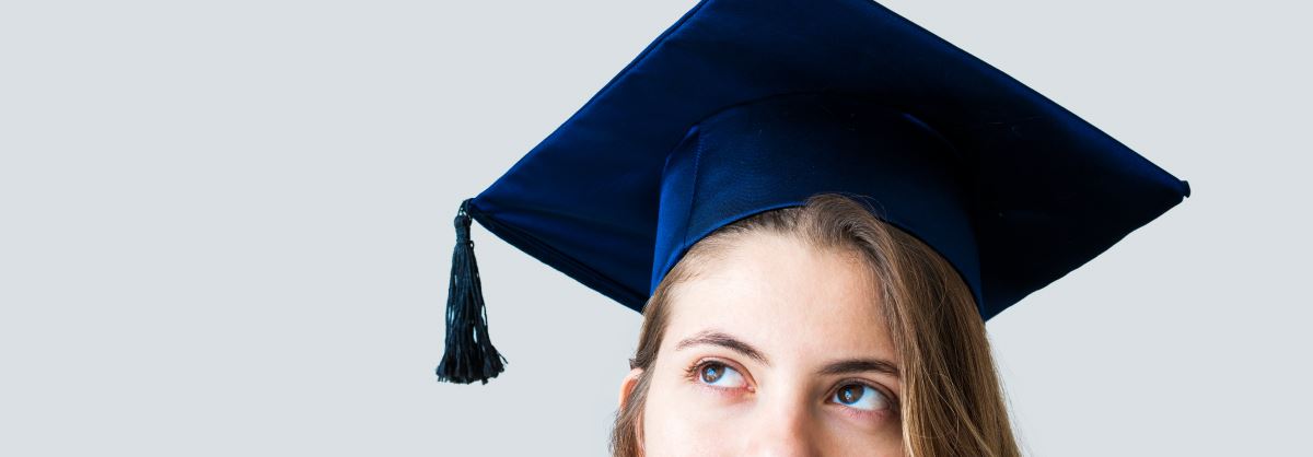 Girl wearing graduation cap.