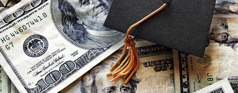 Graduation cap on money.
