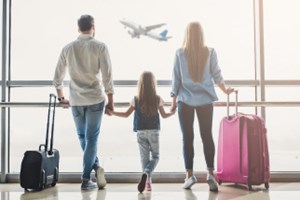 Family Walking Through Airport