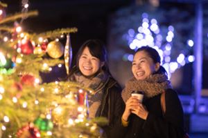 Women Admiring a Christmas Tree