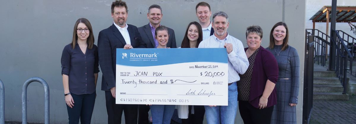 Rivermark team presenting a check donation to Join PDX.