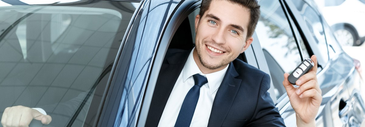 Man Sticking head out of new car