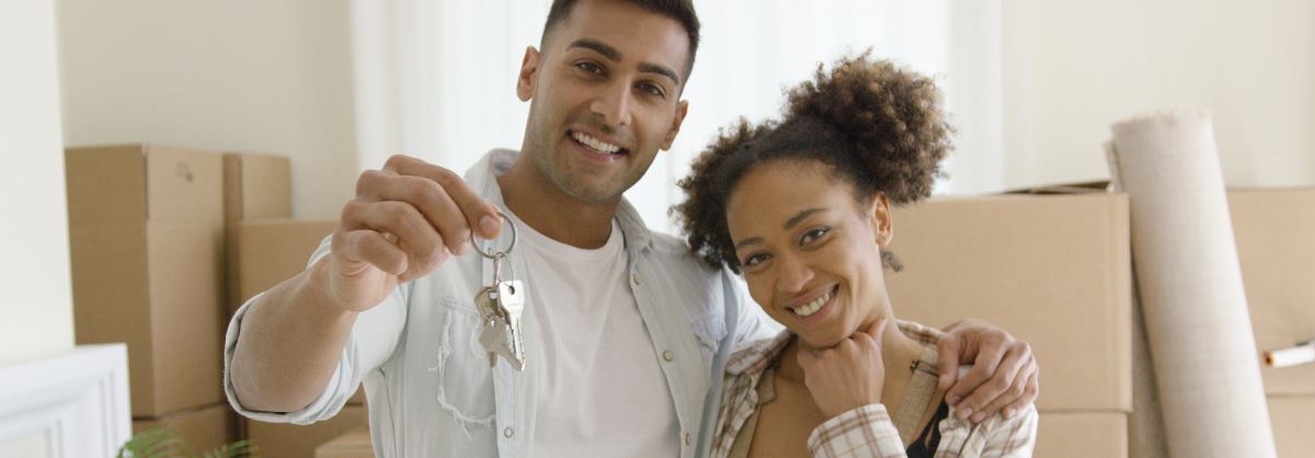 Couple with keys to new home