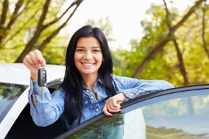 Woman with keys to new car